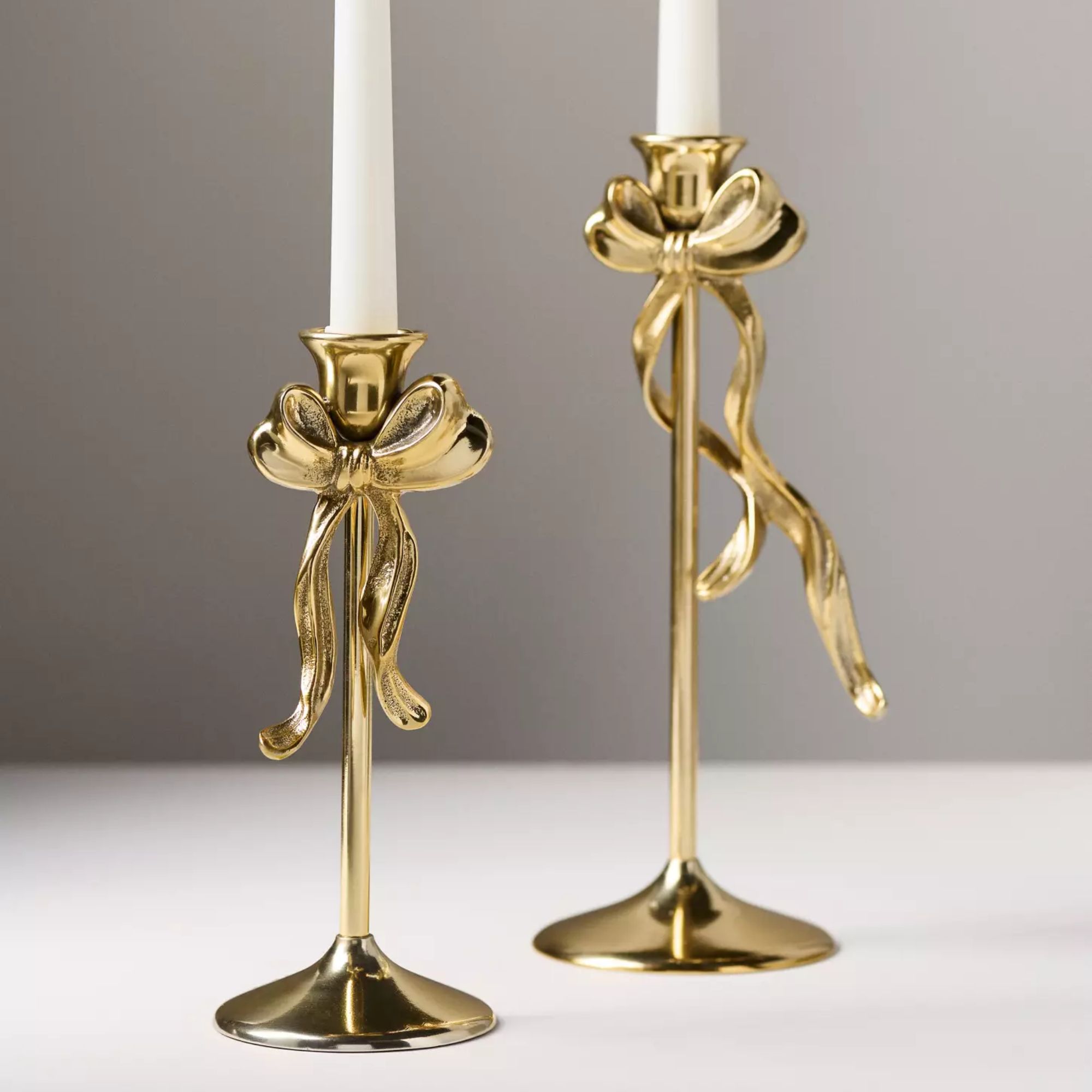 Gold taper candle holder with bowl detail