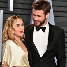 Miley Cyrus and Liam Hemsworth attend the 2018 Vanity Fair Oscar Party
