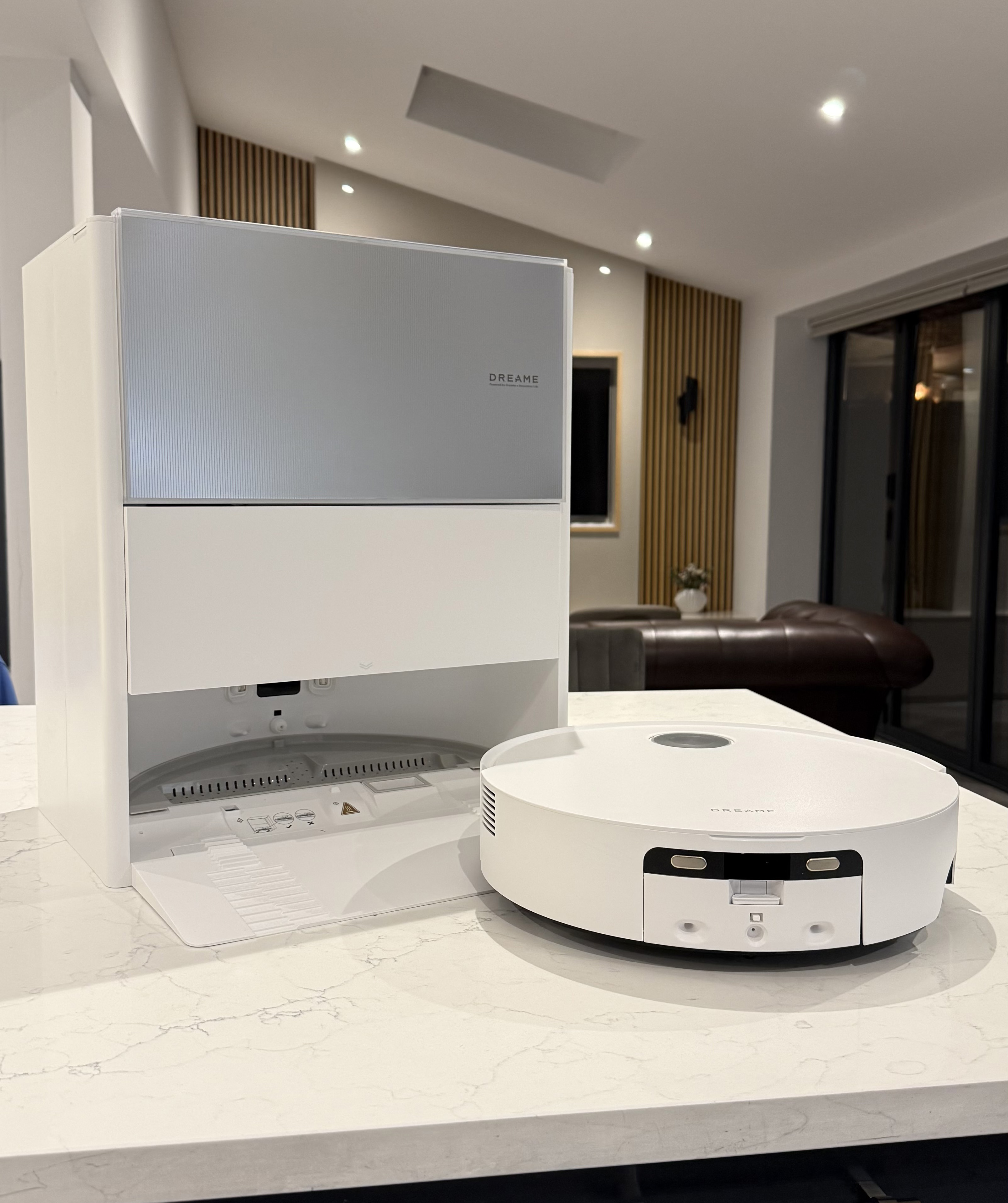 Wide shot of the Dreame Aqua10 Ultra Roller and its self-cleaning dock set up in a modern living space