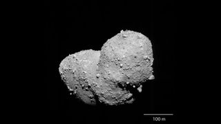 Asteroid Itokawa takes center stage in this photo from the Japan Aerospace Exploration Agency's Hayabusa spacecraft taken in October 2005. An analysis of samples collected by Hayabusa have revealed the origins of Itokawa, scientists say.