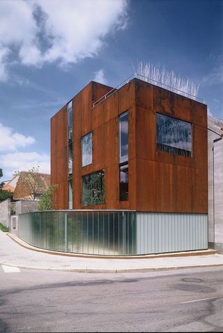Contemporary design of traditional rendered brick facade