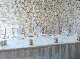 white flower wall behind table by Dorset Flower Walls