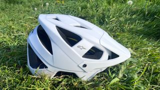 Alpinestars Vector Tech Solid helmet seen side on placed on grass