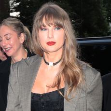 Taylor Swift wearing a clock choker necklace while out in London with friends including Este Haim and Lena Dunham