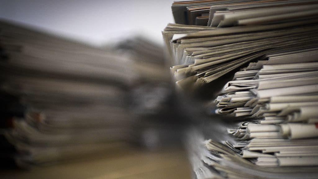 A stack of newspapers.