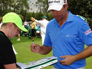 Padraig Harrington signs autographs before teeing off in the Par 3 Contest