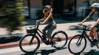 Two people riding e-bikes together