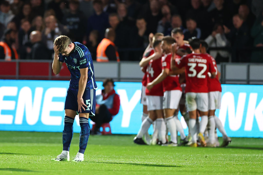 Charlie Cresswell looks dejected after Leeds concede to Salford City in the Carabao Cup