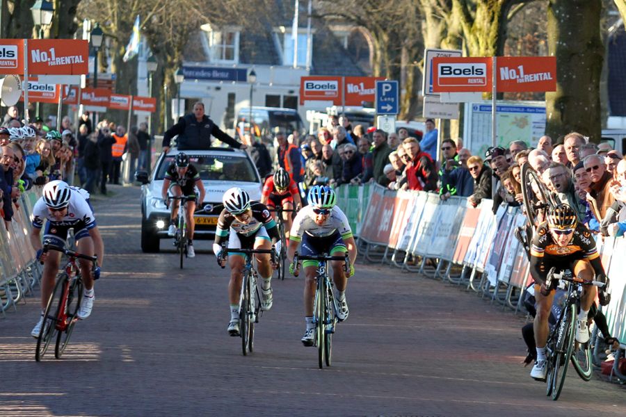 Loren Rowney (Velocio-SRAM) hits the ground after a spectator grabbed her handlebars