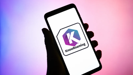 KnowRoaming logo on a silhouetted phone and hand