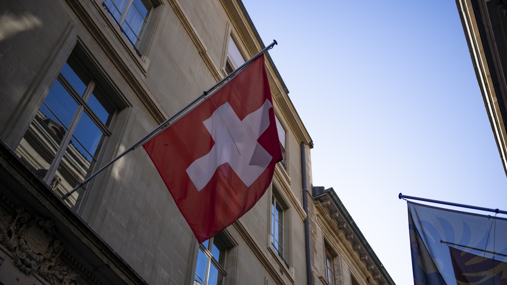 Rows of Swiss national flags hang across fa&amp;ccedil;ades and narrow streets in Geneva&amp;rsquo;s Old Town.