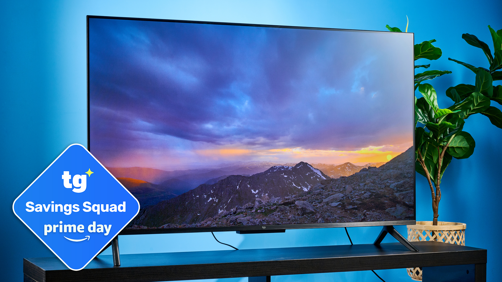 The Amazon Ember 4-Series TV on a TV stand with a Tom's Guide Prime Day badge bottom left