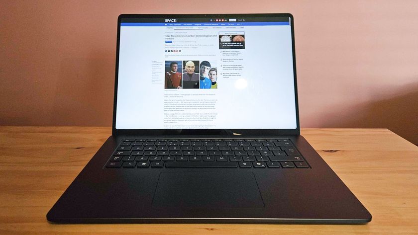 Laptop on table showing full screen display,