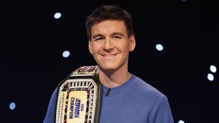 James Holzhauer with Jeopardy championship belt