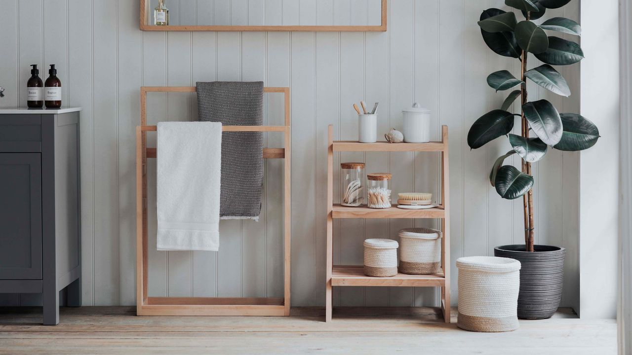 bathroom storage ideas with towel rail in white modern bathroom