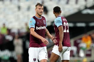 West Ham United’s Andriy Yarmolenko (left) celebrates scoring his side’s fifth goal of the game during the Carabao Cup third round match at the London Stadium