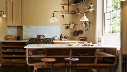 Cozy kitchen design with warm tones and glimmers of copper