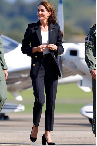 Catherine, Princess of Wales wear a black pantsuit and heels as she visits Royal Naval Air Station (RNAS) Yeovilton on September 18, 2023 in Yeovil, England.