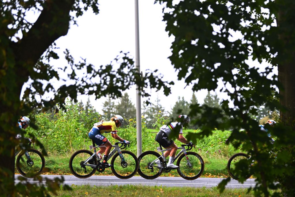 ARNHEM NETHERLANDS OCTOBER 13 LR Franziska Koch of Germany and Team dsmfirmenich PostNL Yellow Leader Jersey and Lotte Kopecky of Belgium and Team SD Worx Protime compete during the 26th Simac Ladies Tour 2024 Stage 6 a 1458km stage from Arnhem to Arnhem UCIWWT on October 13 2024 in Arnhem Netherlands Photo by Luc ClaessenGetty Images