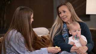 Genie Francis as Laura holding baby Ace in General Hospital