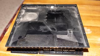 A photo of the PS4 showing the dusty case