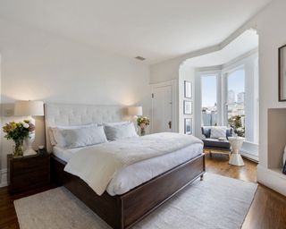 white bedroom with large window