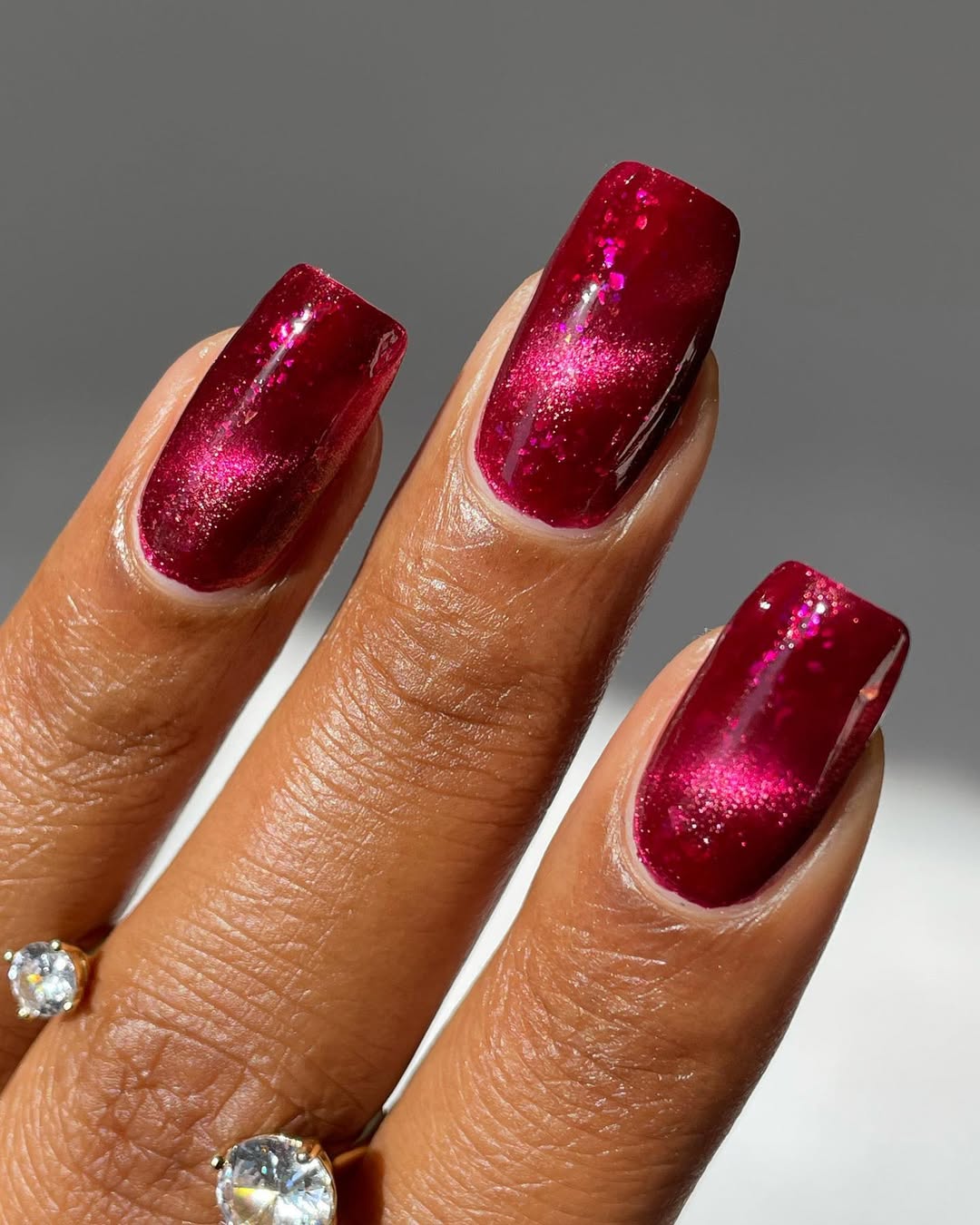 burgundy red nails with pink glitter designs