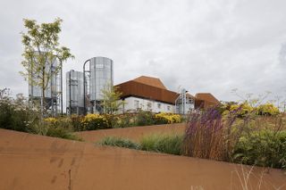Church of oak distillery by ODOS exterior with landscaping