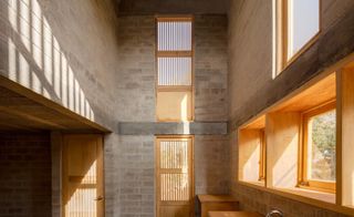 the bare interior of Casa Eva, a low cost housing designed by Fernanda Canales