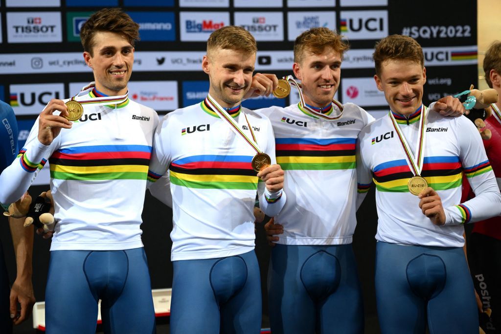 From L Great Britains team riders Ethan Vernon Daniel Bigham Oliver Wood and Ethan Hayter celebrate with their gold medals on the podium after winning the Mens Team Pursuit finals during the UCI Track Cycling World Championships at the Velodrome of SaintQuentinenYvelines southwest of Paris on October 13 2022 Photo by AnneChristine POUJOULAT AFP Photo by ANNECHRISTINE POUJOULATAFP via Getty Images