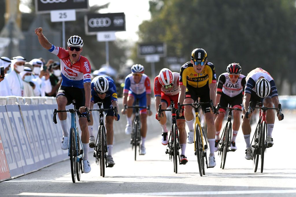 ABU DHABI UNITED ARAB EMIRATES FEBRUARY 21 Arrival Mathieu van der Poel of The Netherlands and Team AlpecinFenix Celebration Michael Morkov of Denmark and Team Deceuninck QuickStep Elia Viviani of Italy and Team Cofidis David Dekker of The Netherlands and Team JumboVisma Emils Liepins of Latvia and Team TrekSegafredo during the 3rd UAE Tour 2021 Stage 1 a 176km stage from Al Dhafra Castle to Al Mirfa UAETour on February 21 2021 in Abu Dhabi United Arab Emirates Photo by Tim de WaeleGetty Images