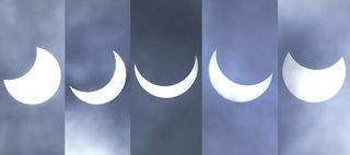 partial solar eclipse with clouds