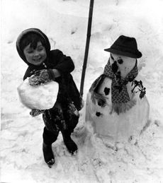 A boy and his frosty pal. 