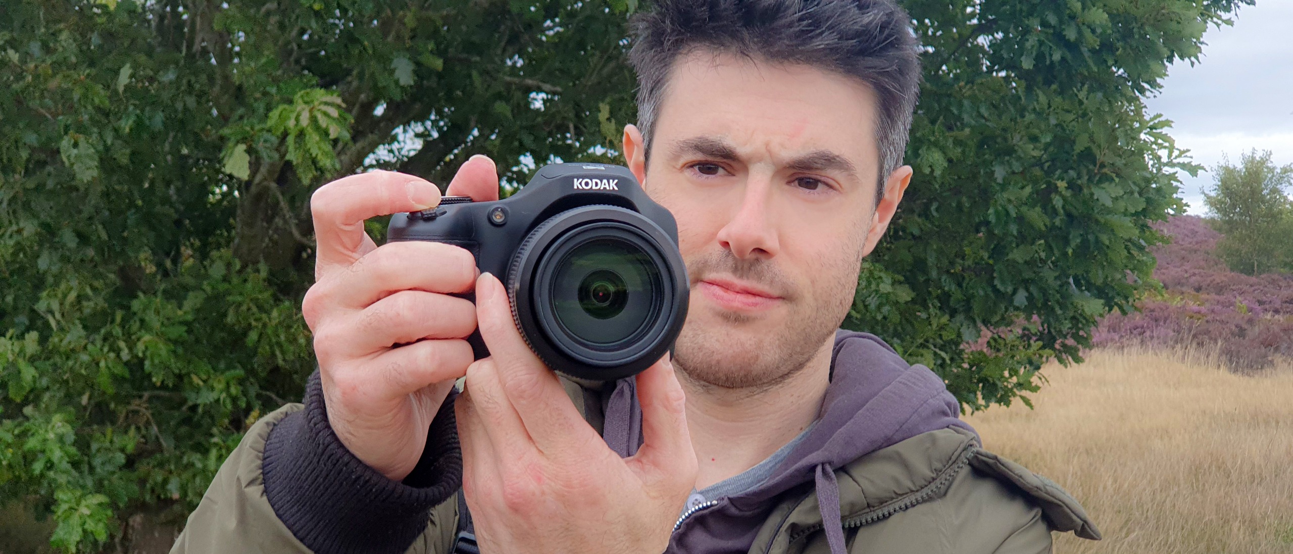 A man with the Kodak Pixpro AZ653 bridge camera