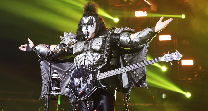 Gene Simmons in full God Of Thunder mode addresses the crows during Kiss&#039;s farewell tour, arms outstretched.