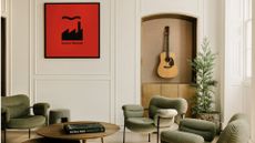 Music room at AP House Manchester, with Factory Records poster and guitar on wall