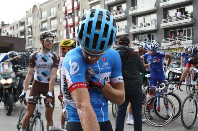Tyler Farrar (Garmin-Sharp) checks that his radio is working