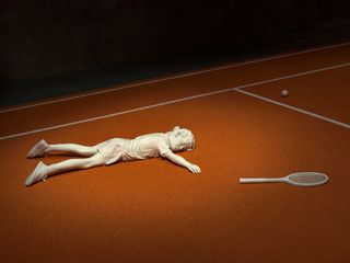 Boy lie down in tennis court