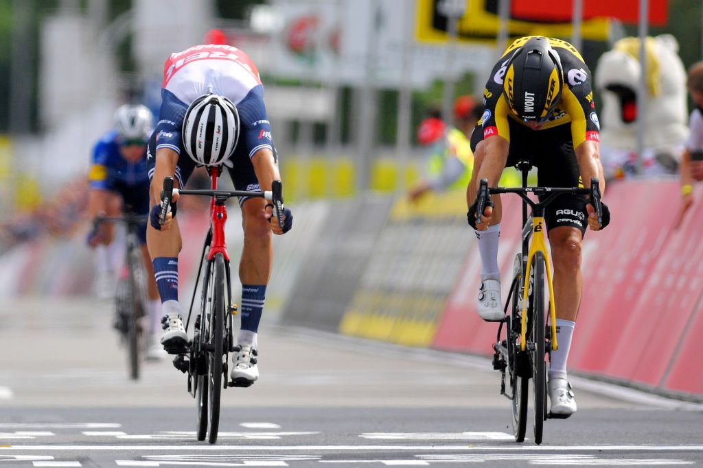 WAREGEM BELGIUM JUNE 20 Edward Theuns of Belgium Wout Van Aert of Belgium sprint at arrival during the 122th Belgian Road Championship 2021 Mens Road Race a 2213km one day race from Waregem to Waregem BELCycling belgiancycling on June 20 2021 in Waregem Belgium Photo by Luc ClaessenGetty Images