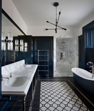 a dark blue elegant painted bathroom