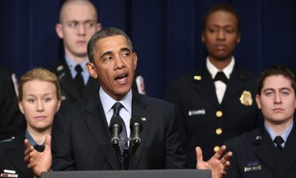 President Obama makes a statement on Feb. 19 while surrounded by first responders who might be impacted by looming budget cuts.