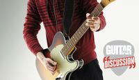 A guitarist wearing a red sweater plays a Fender Telecaster guitar