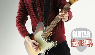A guitarist wearing a red sweater plays a Fender Telecaster guitar