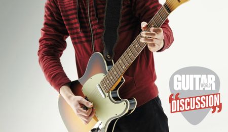 A guitarist wearing a red sweater plays a Fender Telecaster guitar