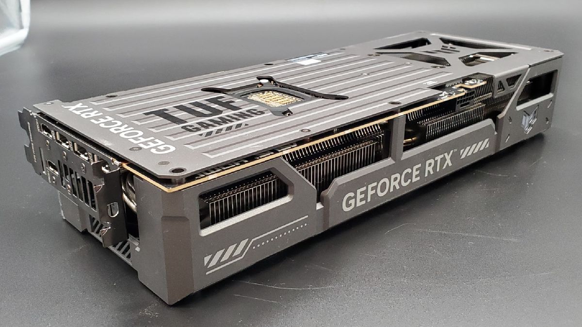 The backplate of the Asus TUF Gaming RTX 5070 Ti OC Edition on a silver background