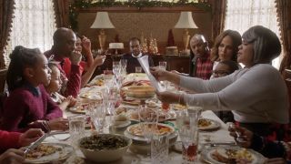 The cast of Almost Christmas gathered around the dinner table