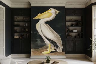A living room with black walls and a pelican bird wallcovering