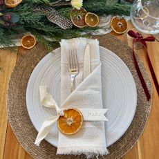 Air dry clay place settings on tablescape for Christmas.
