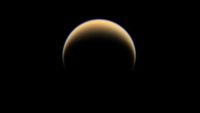 A yellowish crescent pointing downward on a dark background.