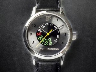 The Nikon F watch has a shutter speed dial at the center of its watch face